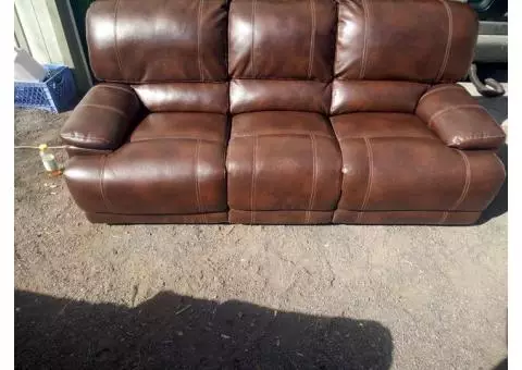 Dual leather reclining sofa and loveseat set